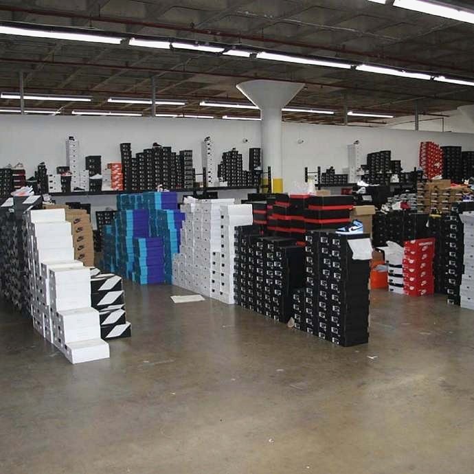 Warehouse shelves of shoe boxes in stock